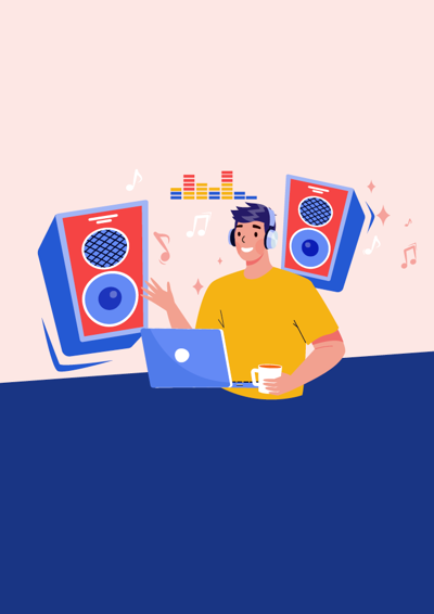 Dreng sidder ved computer og laver musik - store højtaler i baggrunden