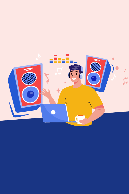 Dreng sidder ved computer og laver musik - store højtaler i baggrunden